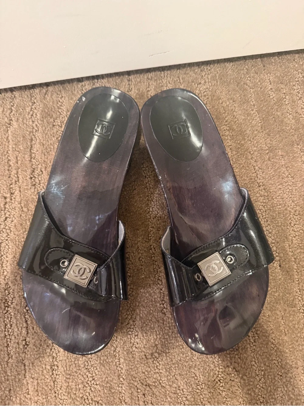 CHANEL Black Patent Leather Slide Mules with Silver Logo Plaque